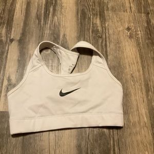 A Nike white bra with a black Nike Singh, stretchy, nice fit